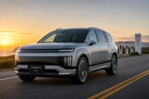 2026 Hyundai Ioniq 9 three-row electric SUV photographed outdoors in daylight with open road and charging infrastructure
